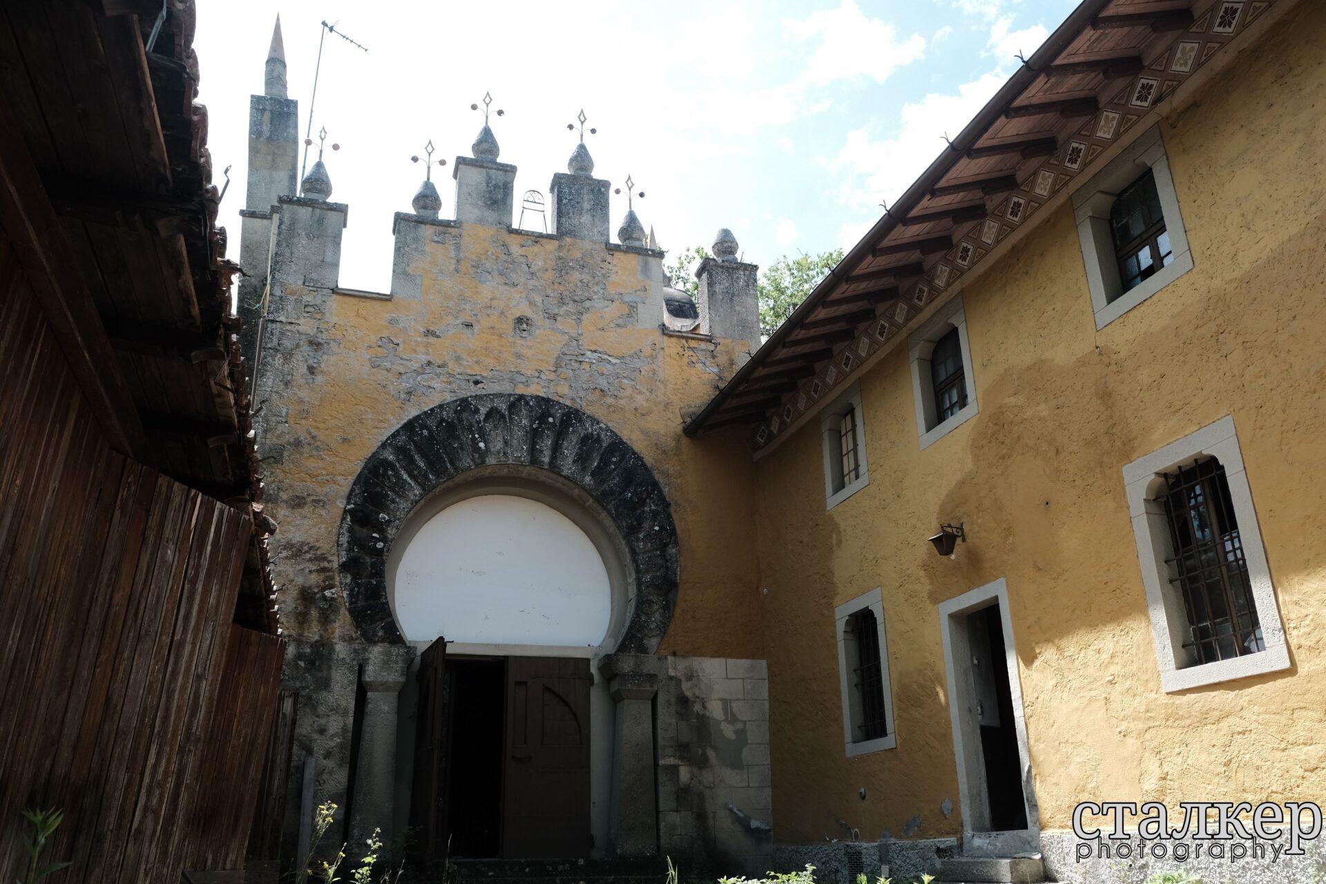 Eclectic exterior facade with Art Nouveau influences surrounded by trees — Bolognese Apennines