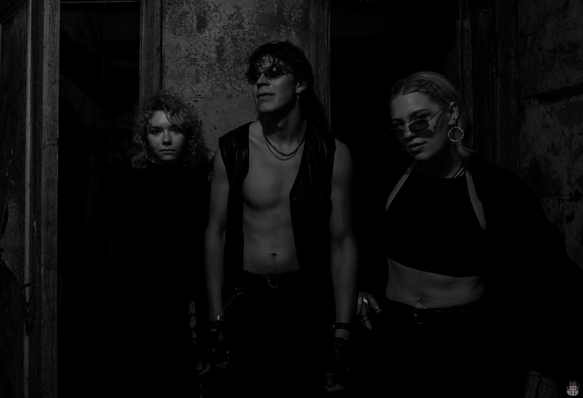 People posing in an abandoned bunker in Latvia