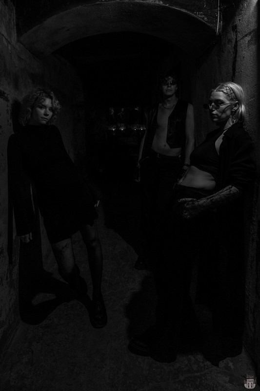 People posing in an abandoned bunker in Latvia